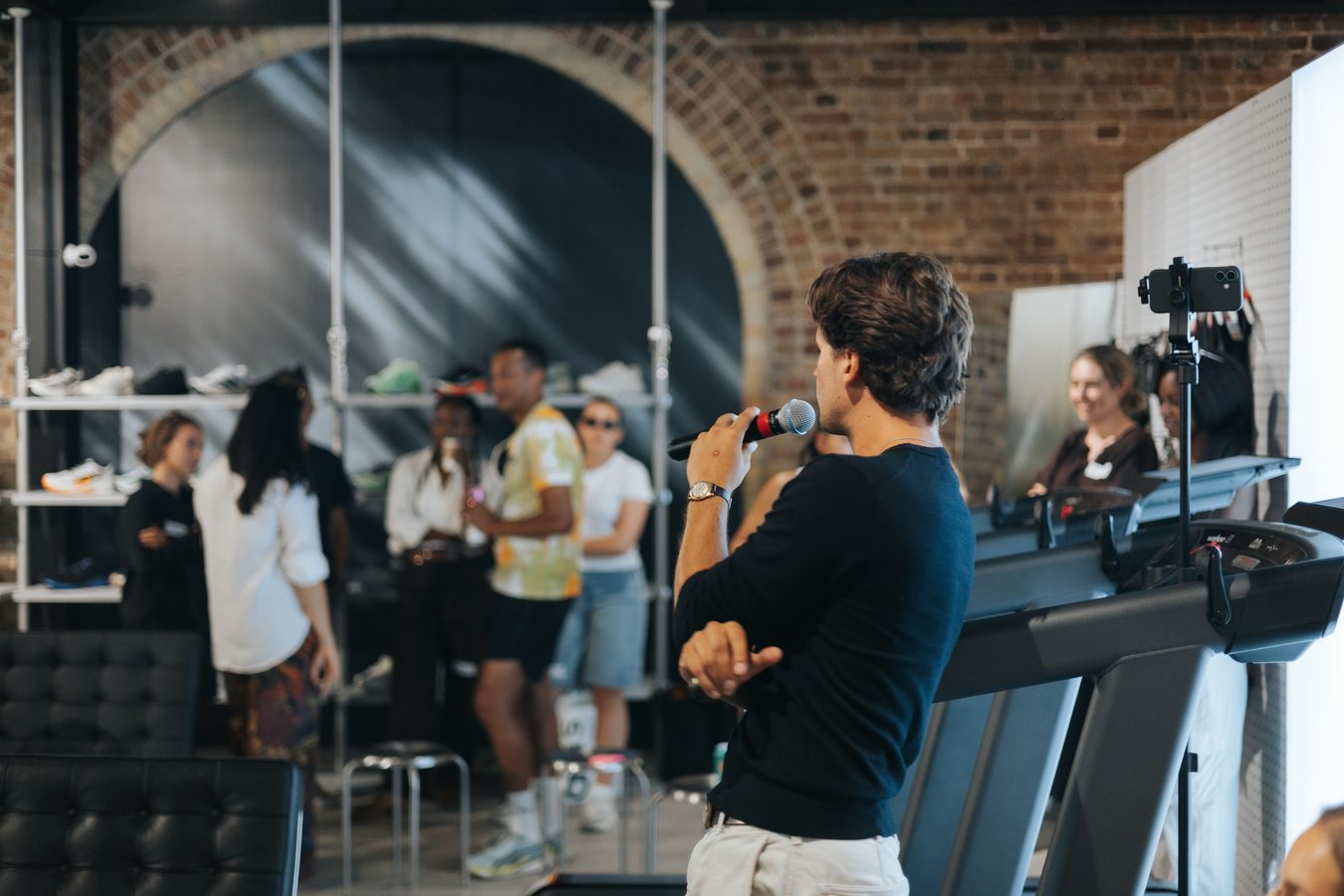 Charlie speaking to a group at a Mood Booster event