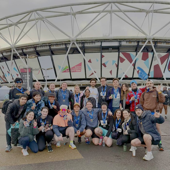The Mood Booster Run Club group photo at the London Stadium after a race